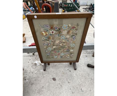 AN UNUSUAL FOLD-OVER FIRESCREEN/TABLE WITH NEEDLEWORK DECORATION 