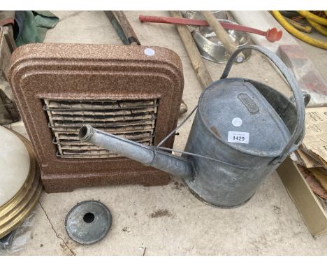A VINTAGE HEATER AND A 2 GALLON WATERING CAN 