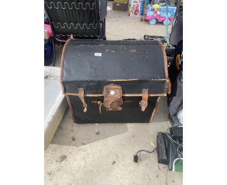 A LARGE FAUX LEATHER BOUND WICKER TRUNK 