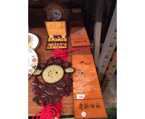 THREE ORIENTAL WALL PLAQUES, ONE WITH RED FRINGING, A MANTEL CLOCK AND A SET OF SILVER PLATE COFFEE BEAN TEASPOONS 