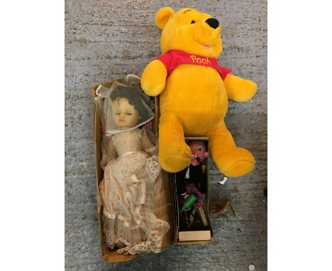 AN ASSORTMENT OF VINTAGE DOLLS, A PELHAM PUPPET OF A SCOTTISH MAN AND A LARGE WINNIE THE POOH TEDDY 