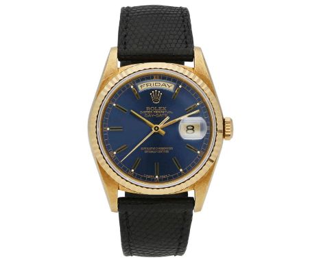 ROLEX HerrenarmbanduhrRolex Day Date in Gelbgold 18K mit geriffelter Lünette in Gelbgold 18K undschwarzem Originalband Leder 