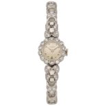 UNIVERSAL Damenarmbanduhr Edle Uhr in Weissgold 18K Lünette sowie Uhrband verziert mit Diamanten.