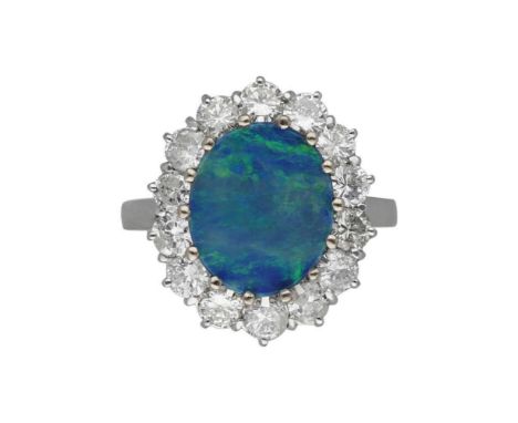 Opal- Brillant-RingNeuwertiges Schmuckstück in Weissgold 18K mit einer Opal-Triplette im Zentrum und begleitet von Brillanten