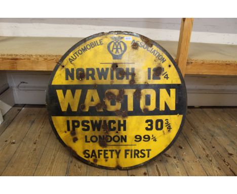 A large vintage automobile Association yellow and black enamel road sign featuring Wacton, Norwich and London etc, diameter 7