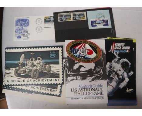 Space memorabilia to include guide, entrance ticket to US Astronaut hall of fame, first day of Issue Stamps for Decade of Ach