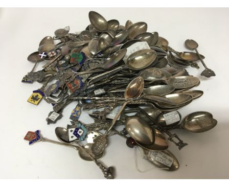 A large collection of silver spoons some decorated with enamel city and Town coats of arms (a lot) weight 1.5kg approximately