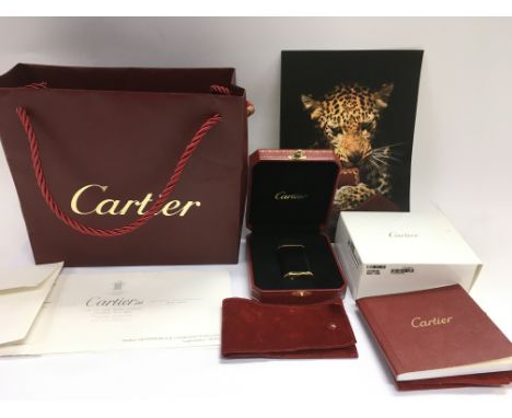 A boxed Cartier lighter, model 336304, with associated paperwork etc.