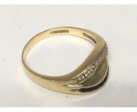 An 18carat gold ring set with a row of small diamonds and sapphire. Ring size P. Weight 3.5g