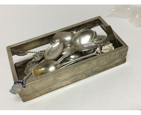 A silver cigarette case (no base) and a quantity of silver and enamel spoons. 640g