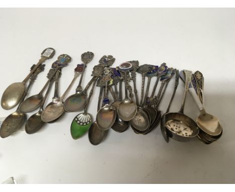 A collection of silver and white metal spoons decorated with enamel (a lot)