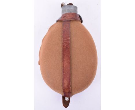 WW1 German Soldiers Water Bottle, light tan felt covering, good colour to the brown leather cradle, leather strong, complete 