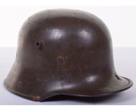 Battle Damaged M.17 Steel Combat Helmet, shell marked ‘SI 63’ retaining much original apple green finish, the shell peppered 