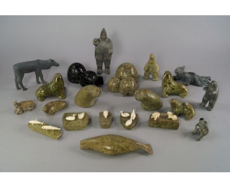 A group of Inuit works of art, 20th century, to comprise a collection of soapstone figures, animals and igloos, including sea