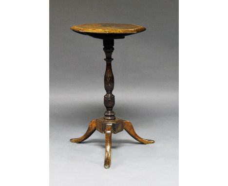 A provincial 19th century "Manx" oak candle stand, tilt top above turned column, on tripod feet, 72cm high 