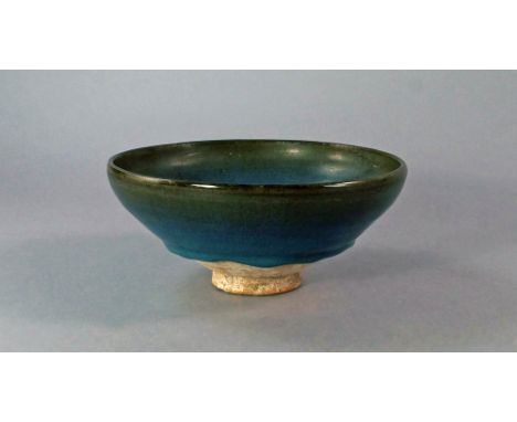 A Chinese Jun ware bowl, 12th/13th century, with a thick blue purple glaze, the interior with a splash of purple, bears label