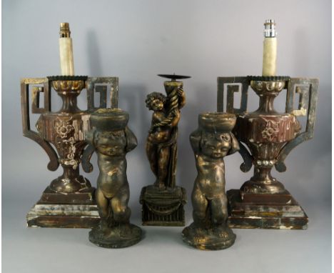 A pair of Italian painted gesso and carved wood candlesticks, 19th century, modeled as urns on stepped bases, formally silver