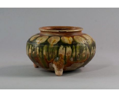 A Chinese Sancai vase, of bellied form, raised on tripod feet, the body with subtle lined engraving, with yellow and green dr