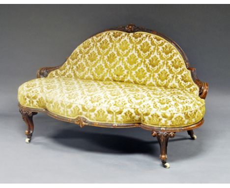 A walnut canape, late 19th/early 20th century, carved foliate back rail, shaped conforming front, raised on cabriole legs, ce