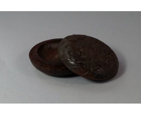 A Chinese Zitan wood circular seal paste pot, possibly late 19th/20th century, in two sections, the top carved with crane and