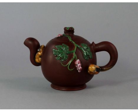 A Chinese Yixing tea pot, 20th century, of globular body, the lid and body applied with rabbits and flower sprays, seal marks