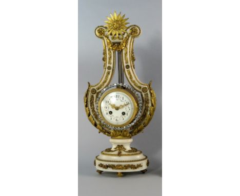 A Louis VXI style white and gilt metal mounted marble lyre clock, 19th century/early 20th century, overall decorated with gil