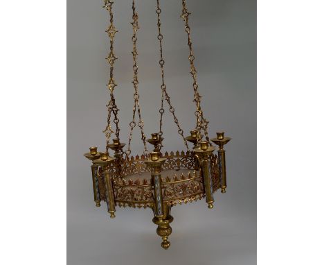 A brass and enamel ecclesiastic eight light chandelier, in the Gothic taste, late 19th/early 20th century, with pierced folia