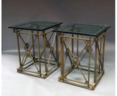A pair of Empire style open steelwork pedestal consoles, with glass tops, the side panels with crossed arrow design, 78 x 56 