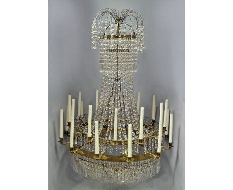 A large and impressive multiple light chandelier, 20th century, the corona with curving wire form top hung with beads, above 