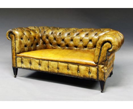 A Victorian brown leather button back Chesterfield chaise lounge, 19th century, on square tapering legs.  