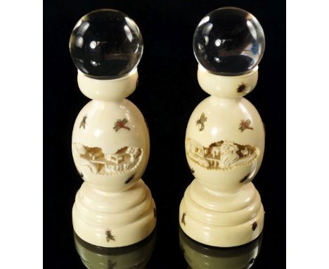 A pair of Japanese ivory turned stands, 19th/early 20th century, of turned baluster form, pierced to front and back with land