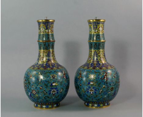 A pair of Chinese cloisonne bottle vases, 19th century, with long collared section necks, decorated with archaic seal script,