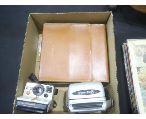Three Instant Polaroid cameras, one in leather case. UK P&amp;P Group 2 (£20+VAT for the first lot and £4+VAT for subsequent 