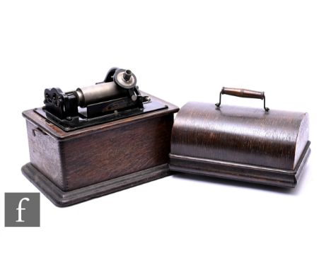 An Edison Standard phonograph, serial number 587121, model H reproducer in oak case, with winder and small horn, with some cy