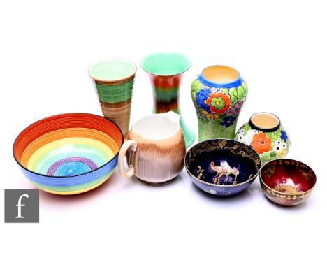 A collection of Art Deco pottery, including a Carlton Melody pattern bowl, in rainbow stripes, two Shelley Harmony vases, a t