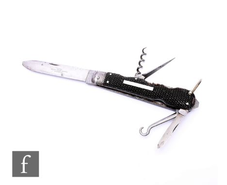 An Underwood lock knife with horn scales, file, corkscrew, hook and removable scissors, tweezers and pick, length when closed