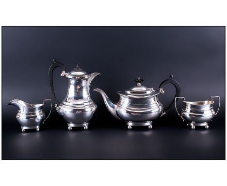 A Silver Four Piece Tea and Coffee Service. Consists of Tea Pot, Coffee Pot, Milk Jug and Sugar Bowl, Having Plain Rectangula