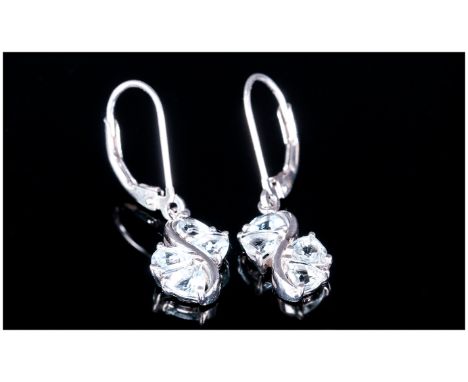 Pair of Aquamarine Drop Earrings, each earring comprising four trillion cut aquamarines in s design with a sweep of platinum 