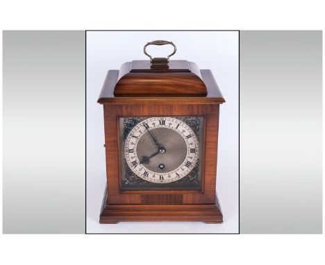 A Modern Polished Oak Cased Mantel Clock, Features Silvered Chapter Ring and Black Numerals with Button Release Glass Panel D