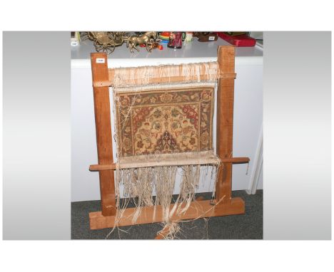 Small Persian Carpet, fixed to a wooden loom frame. Showing the technique of carpet making. 36'' in height 30'' in width