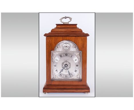 Elliott Clock & Co For Mappin & Webb Ltd and Numbered Walnut Cased Carriage / Mantle Clock. No.93, Silvered Arch Dial. Stands