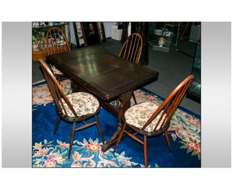 Ercol Dining Table & Four Chairs In A Dark Oak Finish, 4 hoop back Windsor type chair with loose tie on cushions, The table w