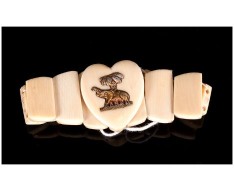 Antique Ivory Expanding Bangle with Shaped Segments, The Central Segment Shaped as a Heart, Attached with a Gilt Metal Elepha