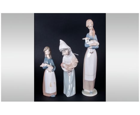 Lladro Figures ( 3 ) In Total, Girls With Animals. 1/ Girl with Lamb, Model Number 4505, Issue Year 1969, Height 10.5 Inches.