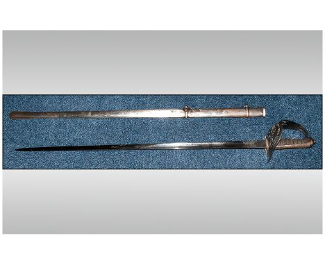 British Officers Patent Sword And Scabbard With Engraved Blade. George V, London made. Fish skin grip, basket handle and Roya