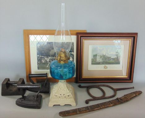 A 19th century oil lamp with cast iron base, 7lb Avery weight, Burmese short sword, two 19th century flat irons, a Regency re