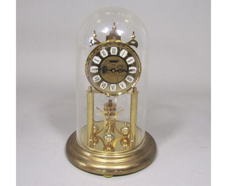 Haller brass torsion clock, under a glass dome, 29cm high in total 