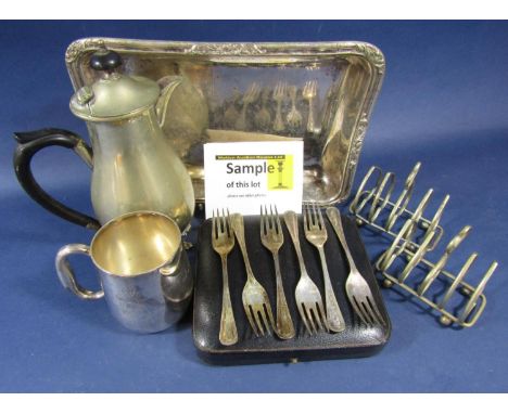 A box containing a collection of silver plated wares comprising lidded entrée dishes, toast racks and boxed flatware 