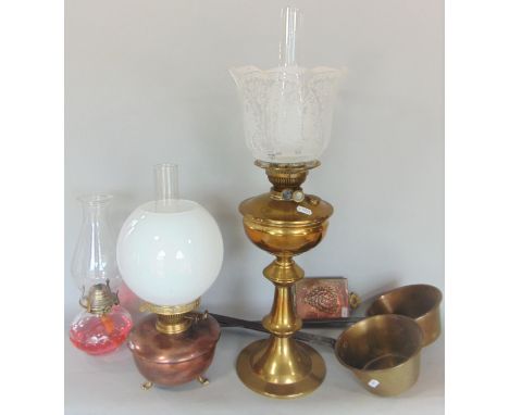 A brass oil lamp with etched glass shade, a further copper oil lamp, two saucepans with steel handles, etc 