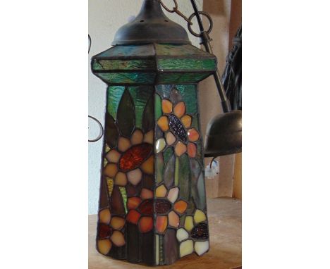 A leaded light ceiling shade of hexagonal form with coloured floral panels 